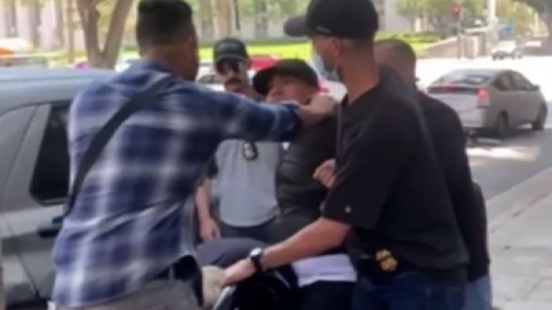 Disturbing Video Shows Man Being Escorted into Unmarked Vehicle Outside Los Angeles Courthouse